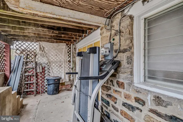 a view of entryway with wooden stairs
