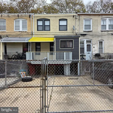 a front view of a house with glass windows