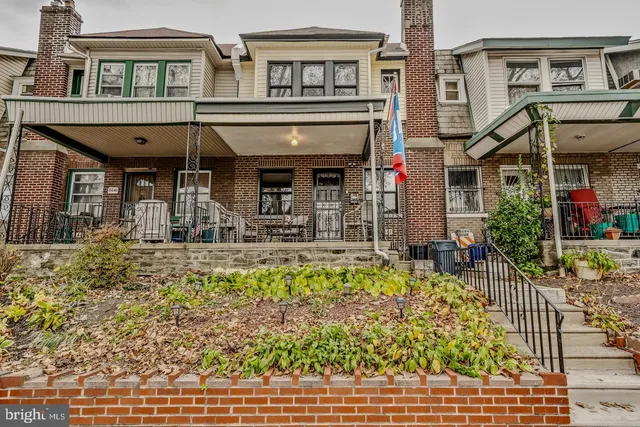 a front view of a house with swimming pool