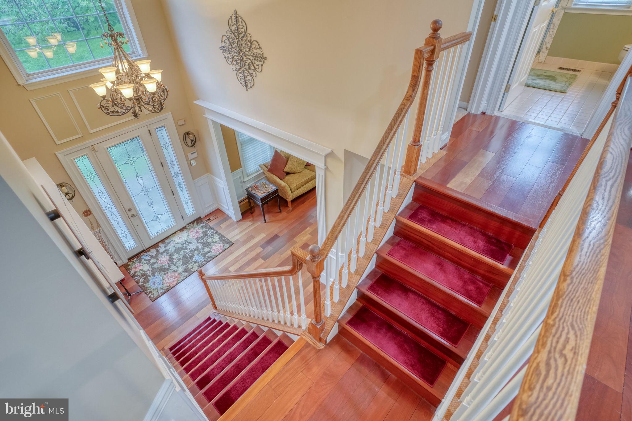 357 Willits Way Garnet Valley, PA 19060 - Photo 31 of 63 a living room with wooden floor and stairs