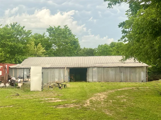 a house view with swimming pool and wooden fence
