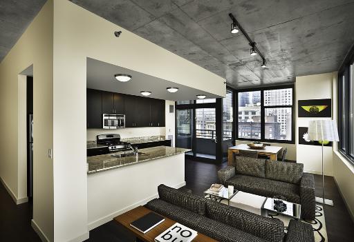 235 West Van Buren Street, Unit 2601 Chicago, IL 60607 - Photo 4 of 11 a living room with furniture and a large window