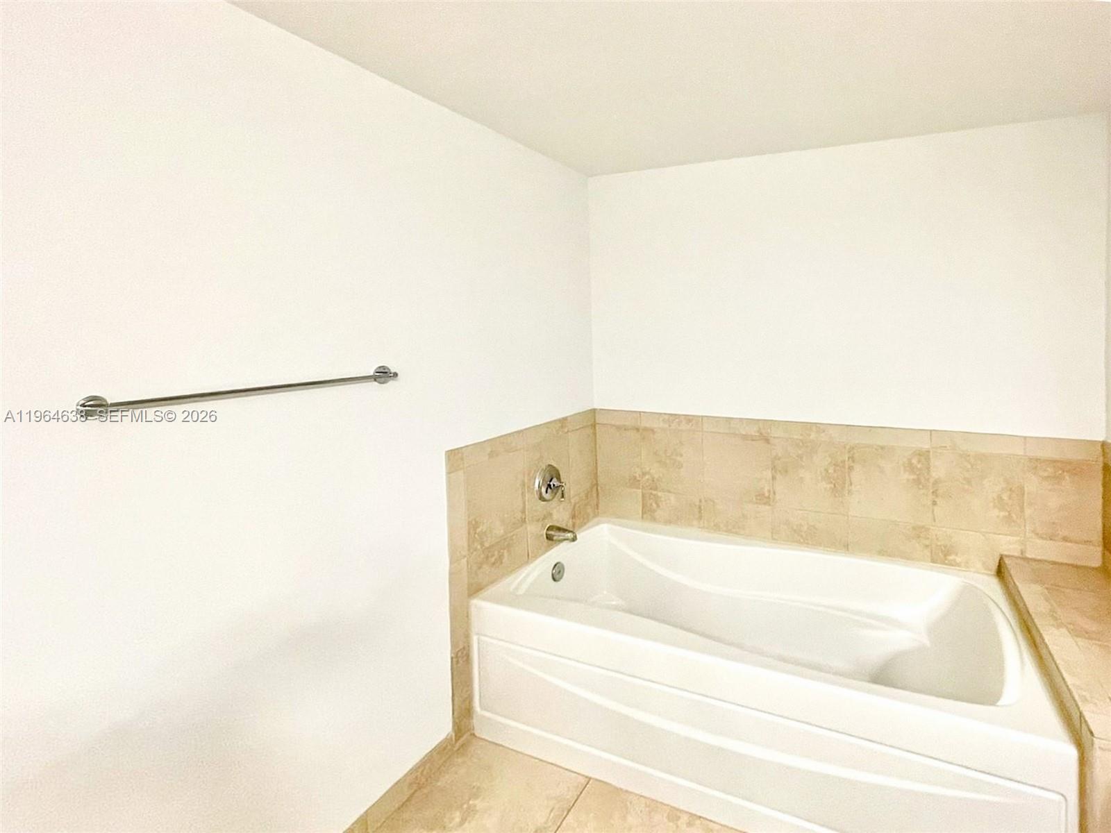 55 Merrick Way, Unit 715 Coral Gables, FL 33134 - Photo 16 of 52 a bathroom with a bathtub
