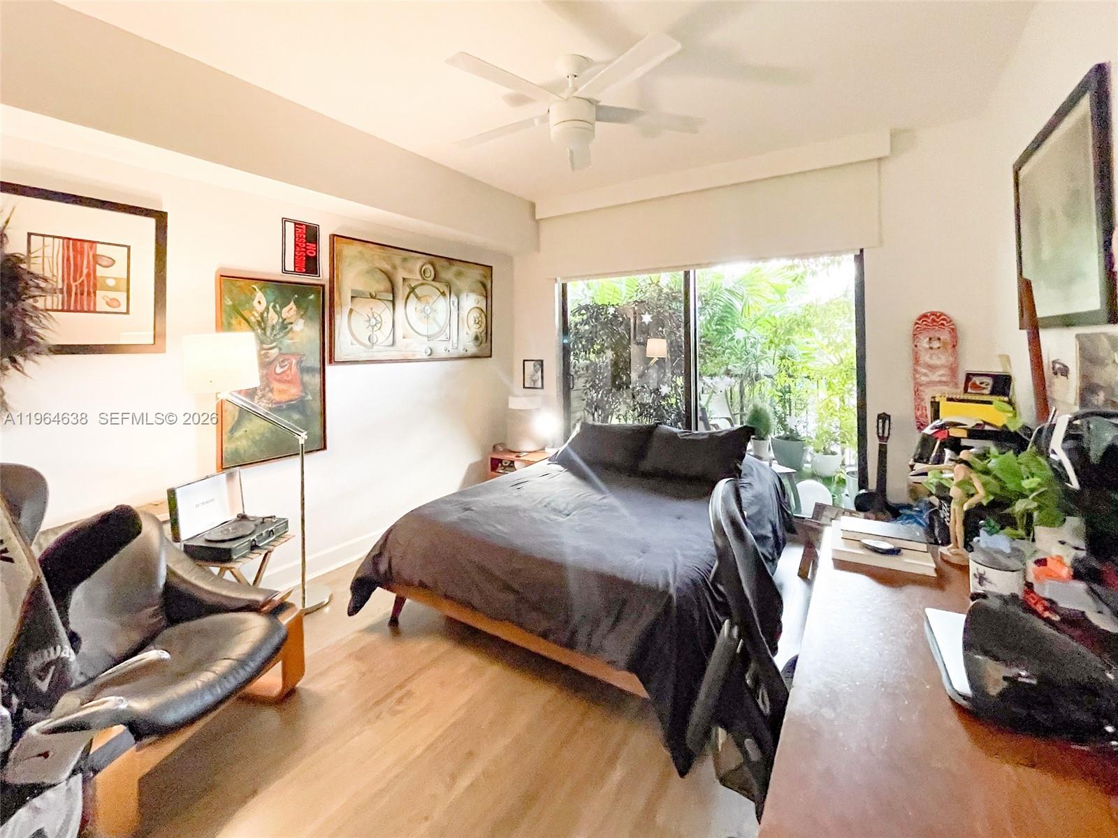 55 Merrick Way, Unit 715 Coral Gables, FL 33134 - Photo 18 of 52 a bedroom with a bed furniture and a large window