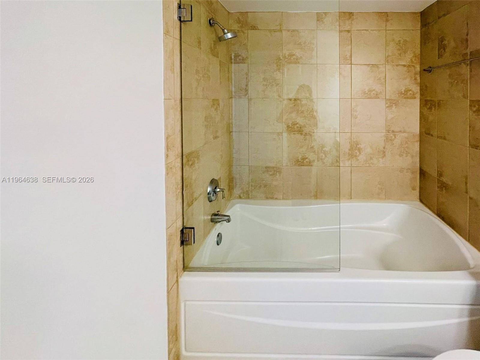 55 Merrick Way, Unit 715 Coral Gables, FL 33134 - Photo 25 of 52 a bathroom with a bathtub