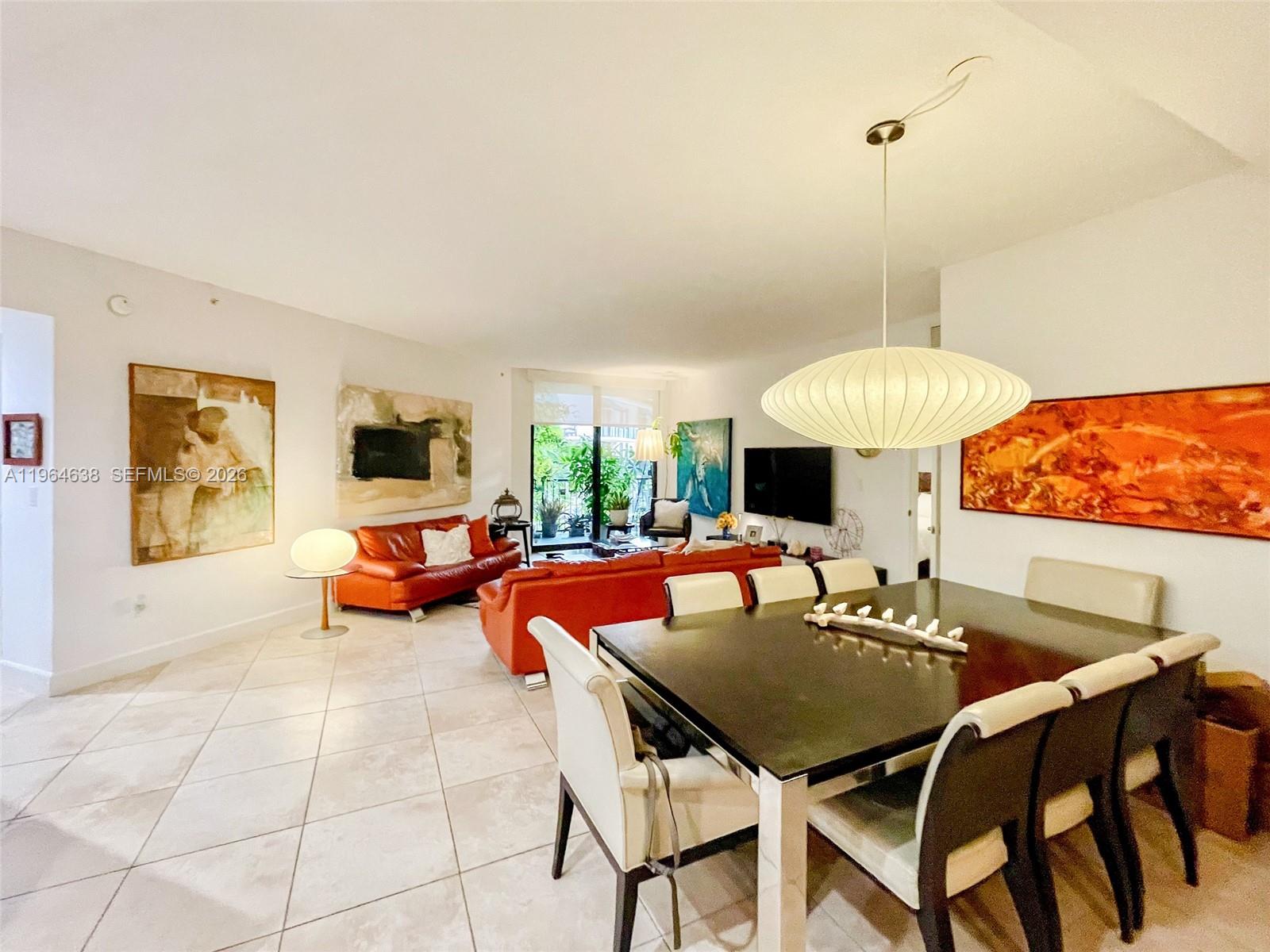 55 Merrick Way, Unit 715 Coral Gables, FL 33134 - Photo 3 of 52 a outdoor space with furniture and a fireplace