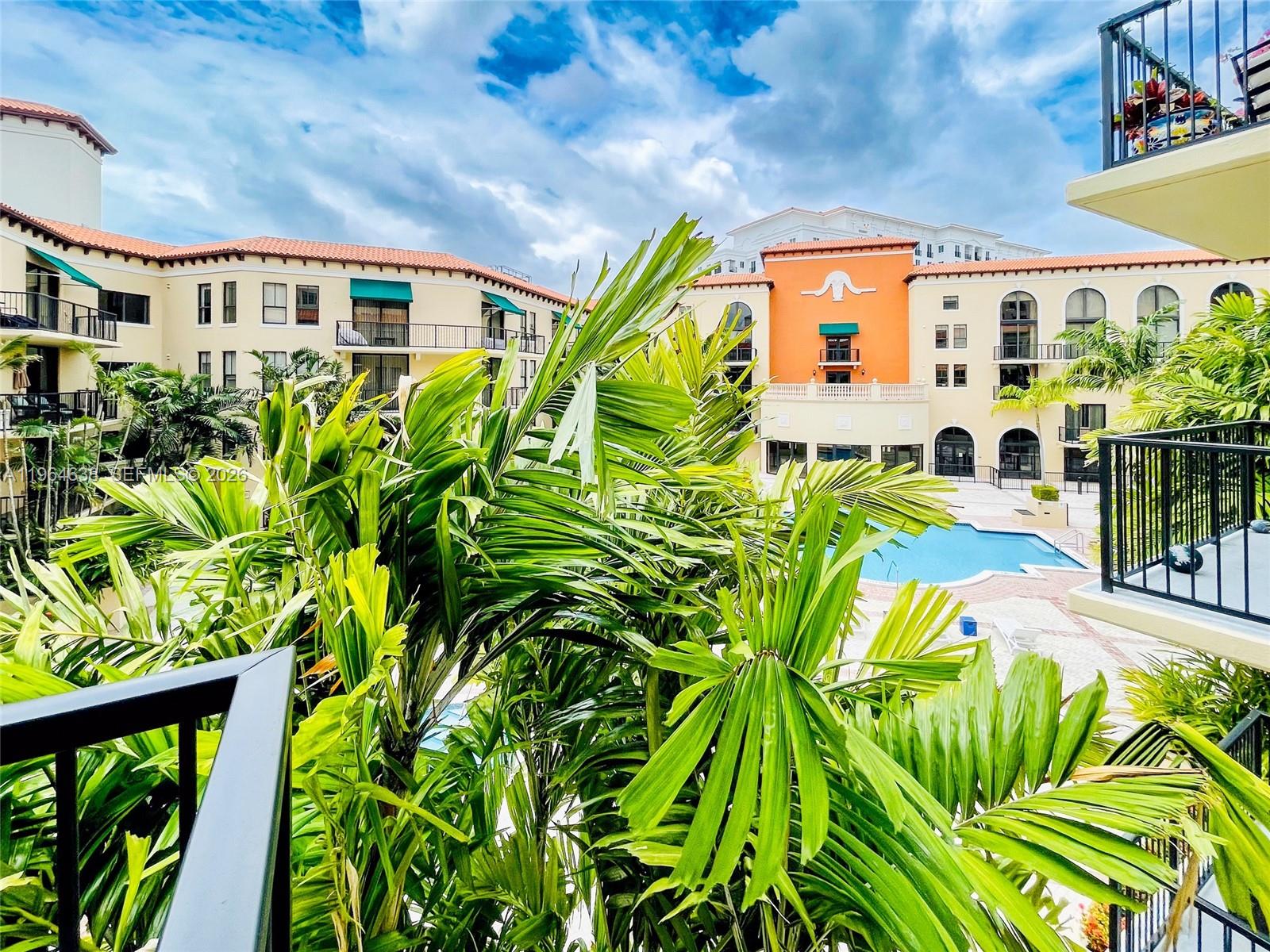 55 Merrick Way, Unit 715 Coral Gables, FL 33134 - Photo 35 of 52 a view of a swimming pool with a patio
