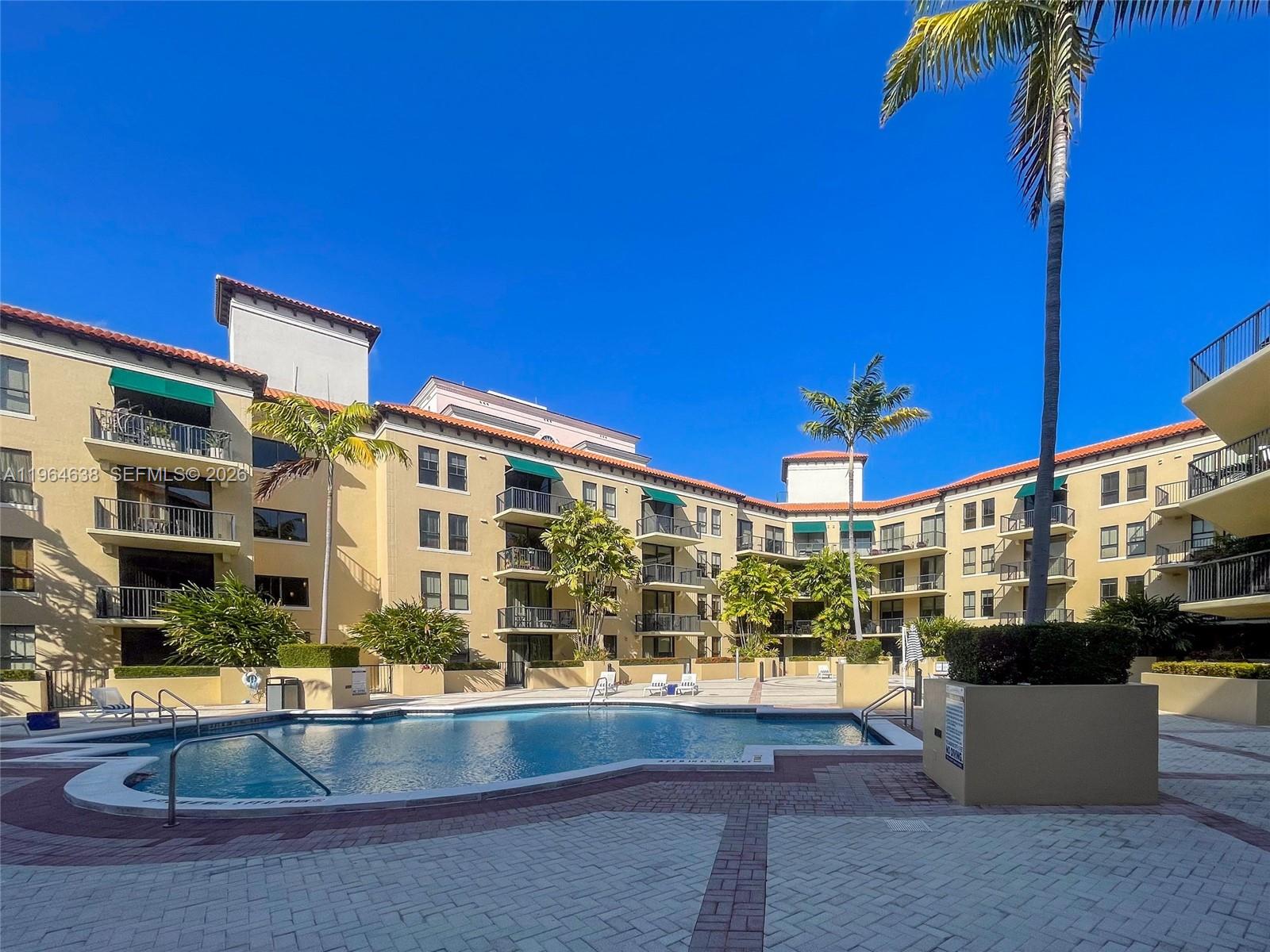 55 Merrick Way, Unit 715 Coral Gables, FL 33134 - Photo 37 of 52 a view of a building with a swimming pool