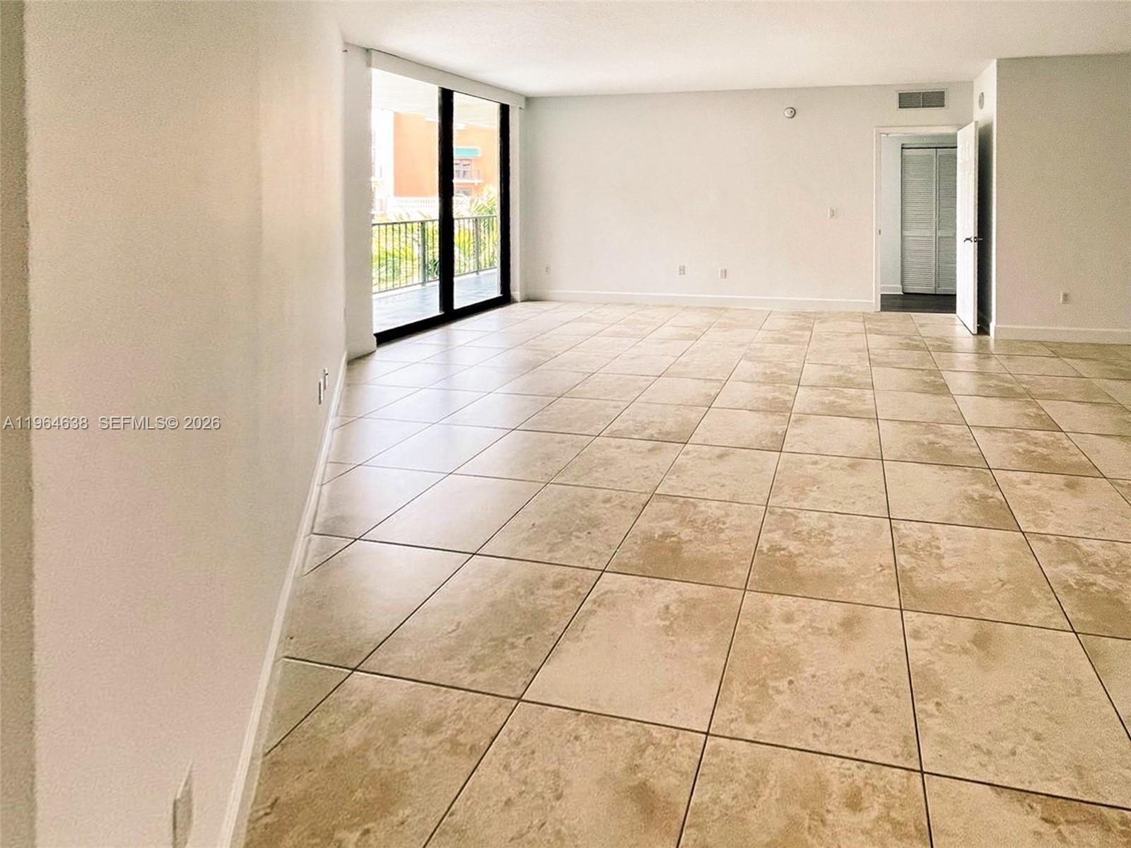 55 Merrick Way, Unit 715 Coral Gables, FL 33134 - Photo 4 of 52 a view of an empty room with a window