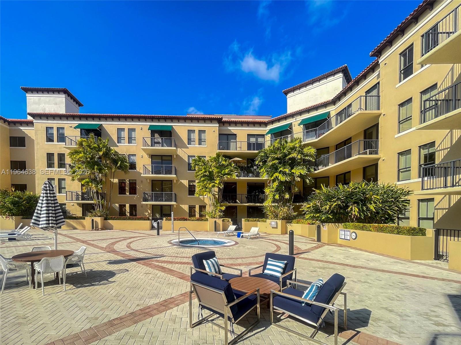 55 Merrick Way, Unit 715 Coral Gables, FL 33134 - Photo 43 of 52 a view of a building with sitting area
