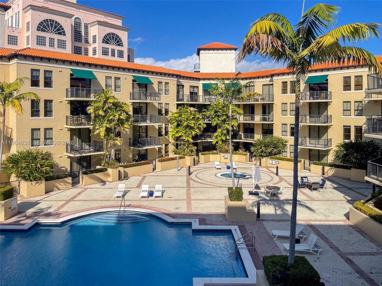 55 Merrick Way, Unit 715 Coral Gables, FL 33134 - Photo 50 of 52 a view of a building with many windows