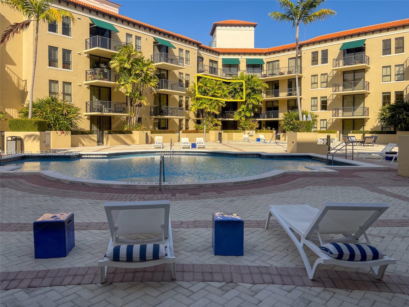 55 Merrick Way, Unit 715 Coral Gables, FL 33134 - Photo 8 of 52 a building exterior with outdoor seating