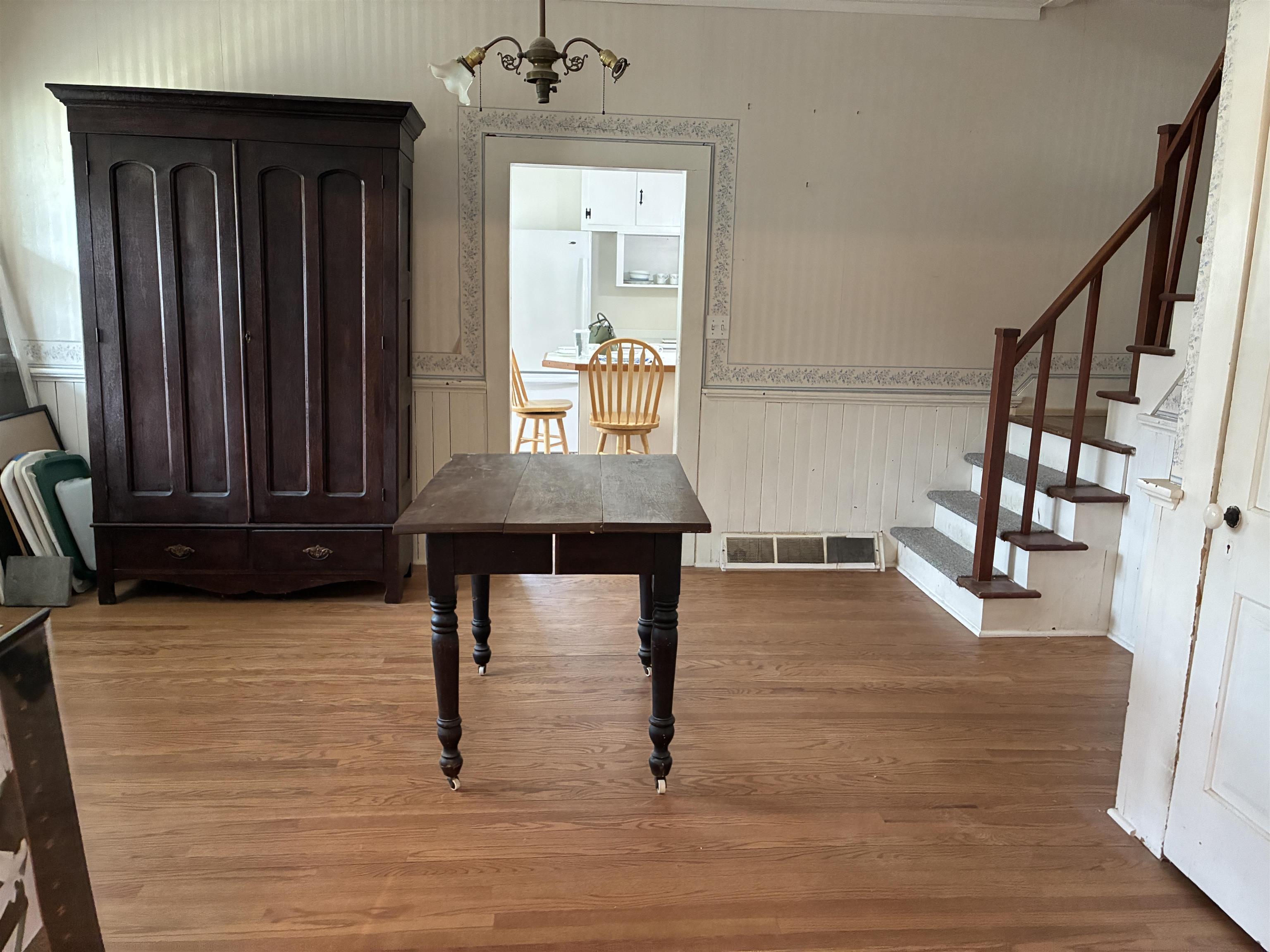 115 North Clay Street Mount Carroll, IL 61053 - Photo 15 of 61 a view of a entryway door with wooden floor and furniture