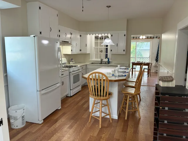 a kitchen with a table and chairs