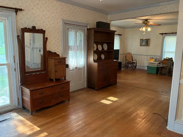 a living room with furniture and a window