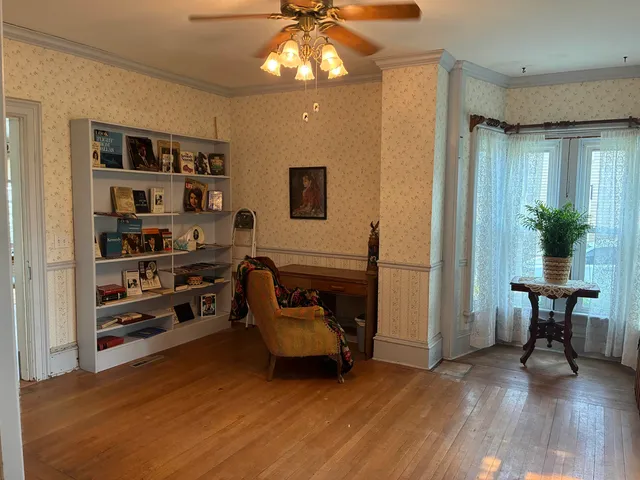 a view of entryway with wooden floor and stairs