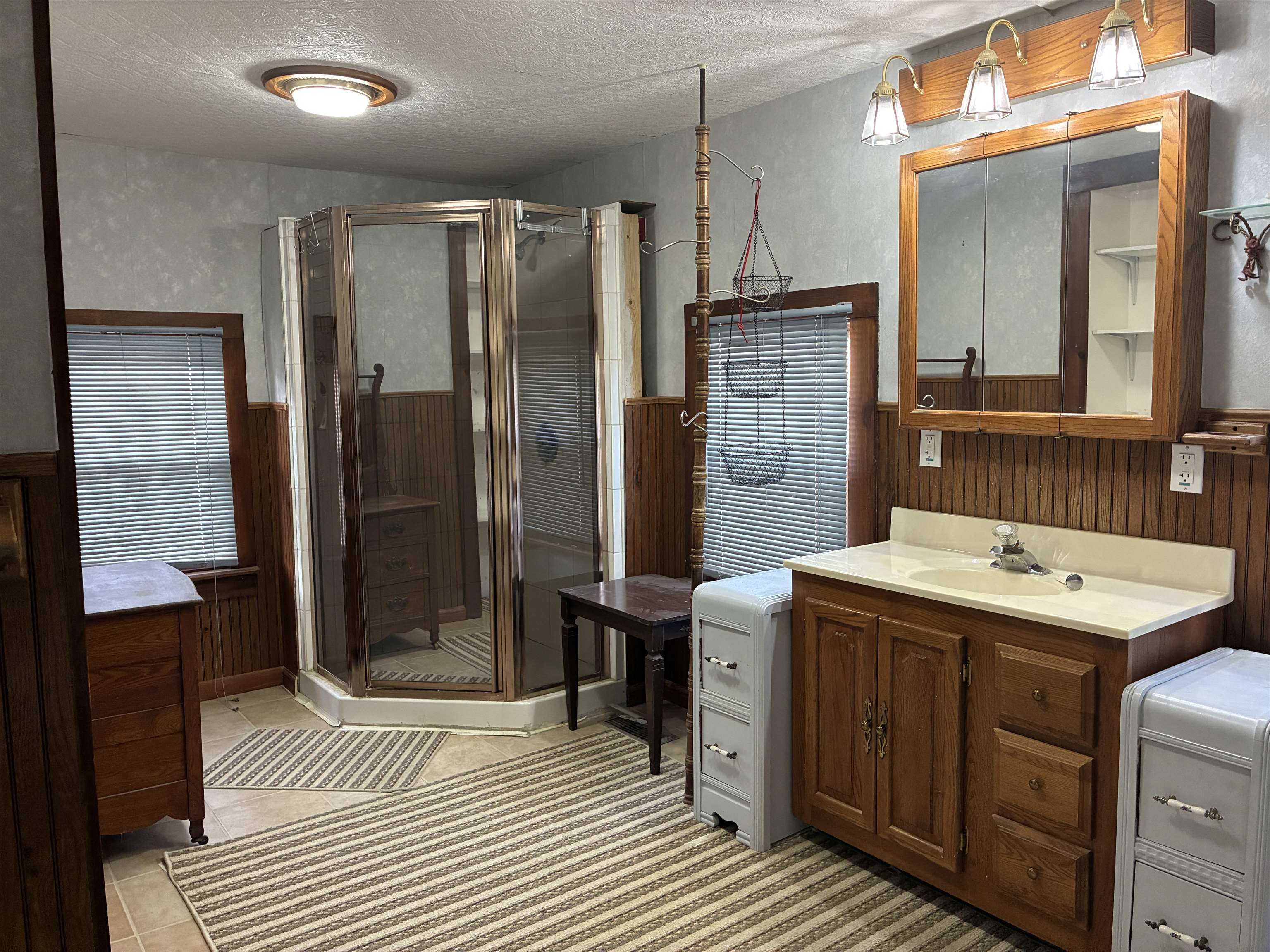 115 North Clay Street Mount Carroll, IL 61053 - Photo 29 of 61 a bathroom with a sink a toilet and shower