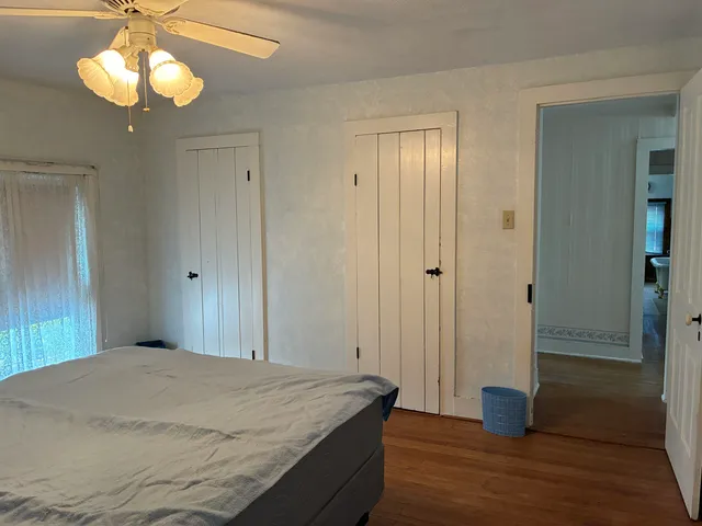 an empty room with wooden floor