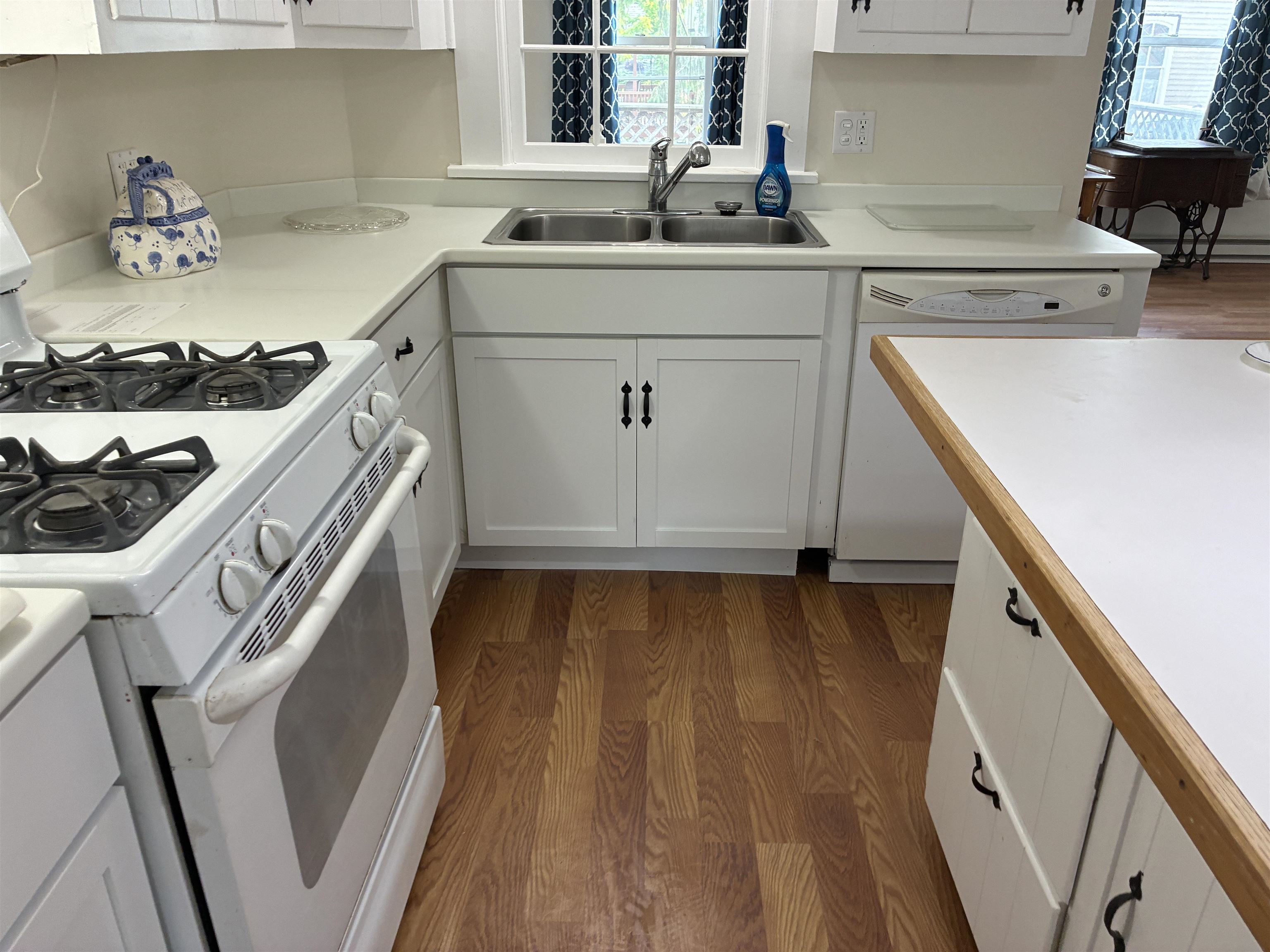 115 North Clay Street Mount Carroll, IL 61053 - Photo 4 of 61 a kitchen with a sink a stove and cabinets