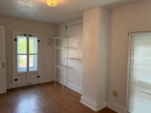 a room with gym equipment and a mirror