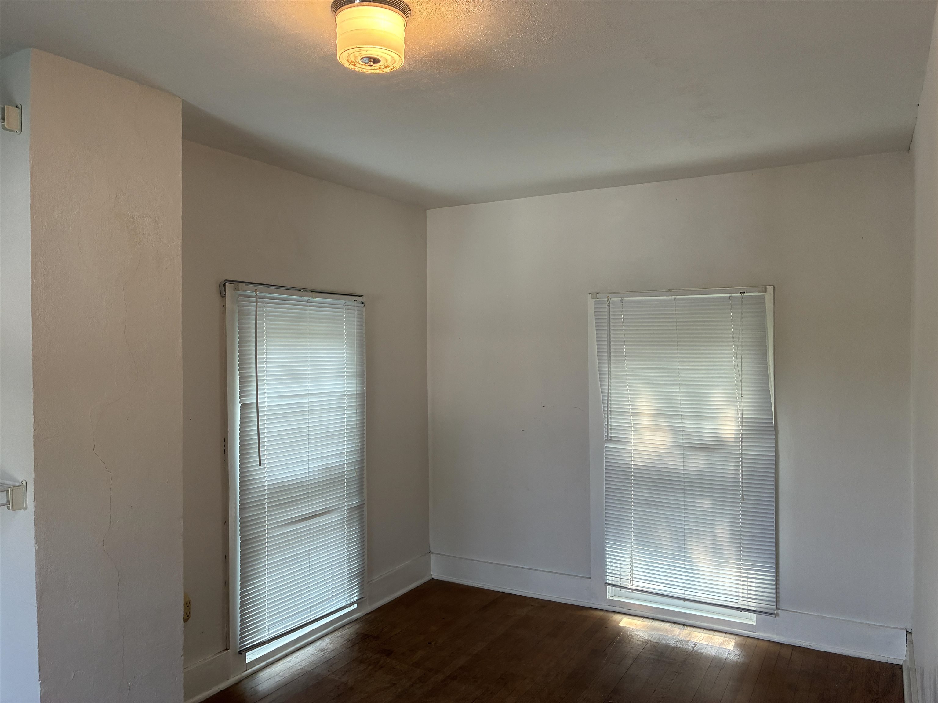 115 North Clay Street Mount Carroll, IL 61053 - Photo 45 of 61 an empty room with wooden floor and door