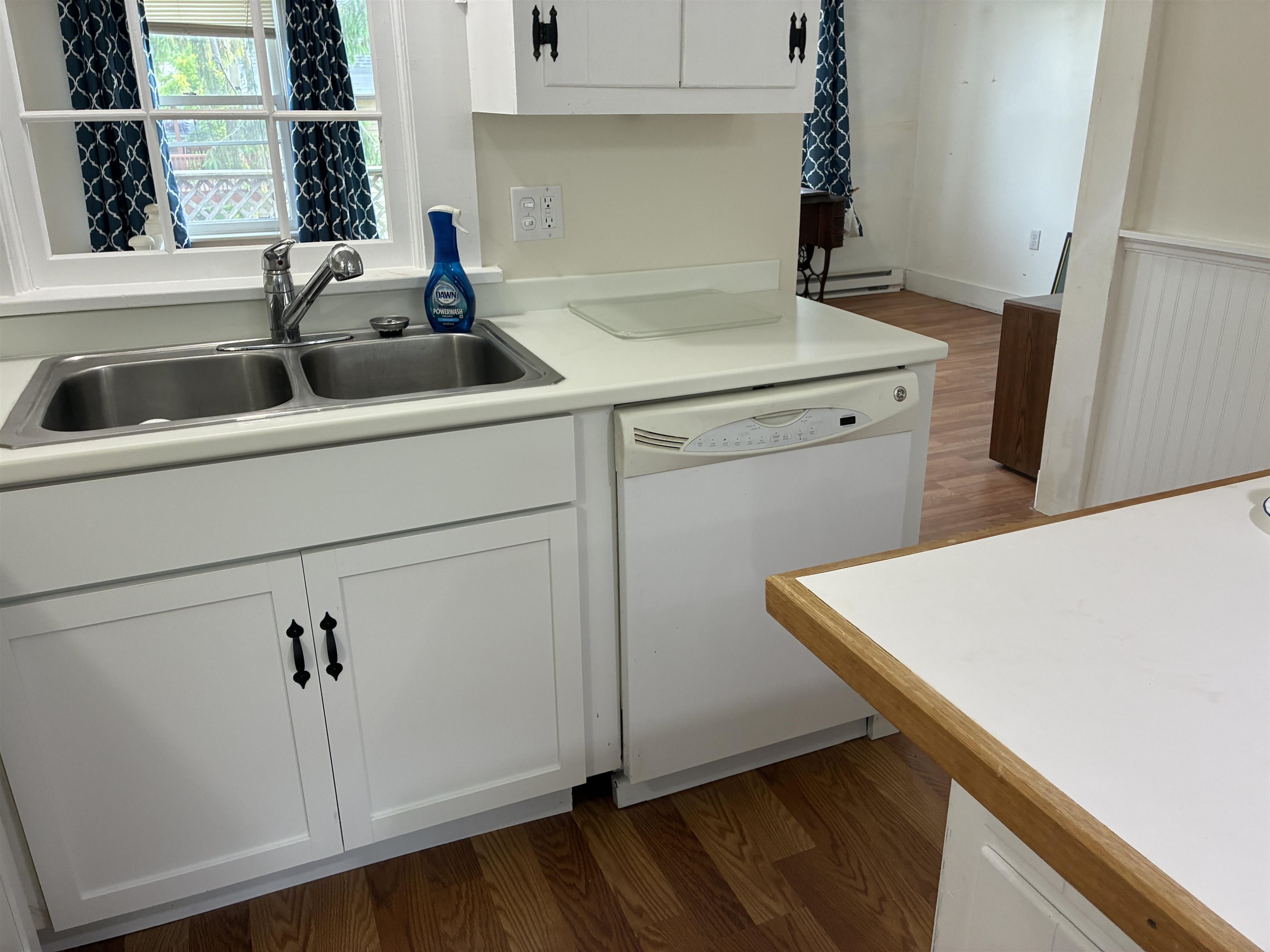 115 North Clay Street Mount Carroll, IL 61053 - Photo 5 of 61 a kitchen with a sink and cabinets