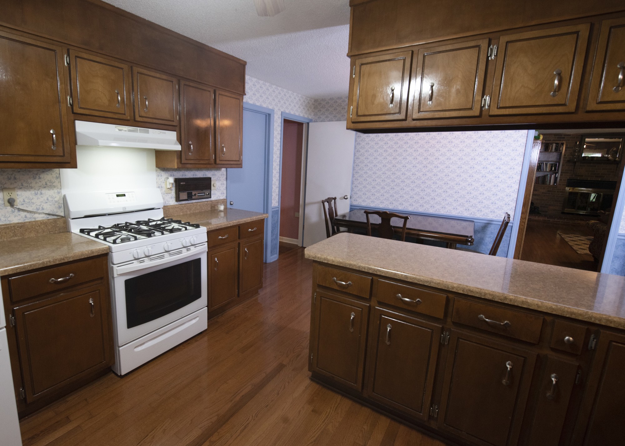 836 Dripping Springs Road Winchester, TN 37398 - Photo 11 of 37 a kitchen with granite countertop stainless steel appliances and wooden cabinets