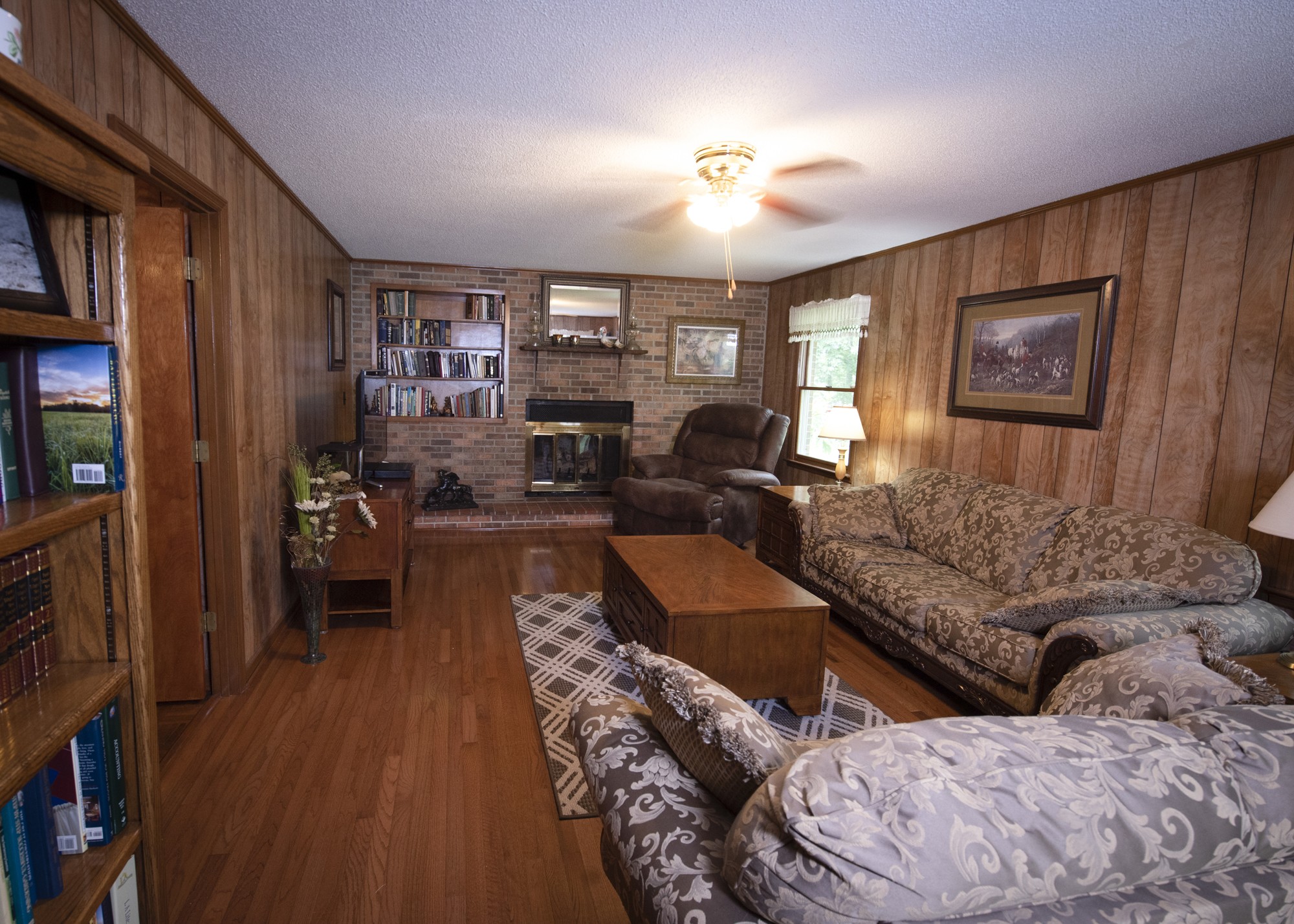 836 Dripping Springs Road Winchester, TN 37398 - Photo 13 of 37 a living room with furniture and a bookshelf