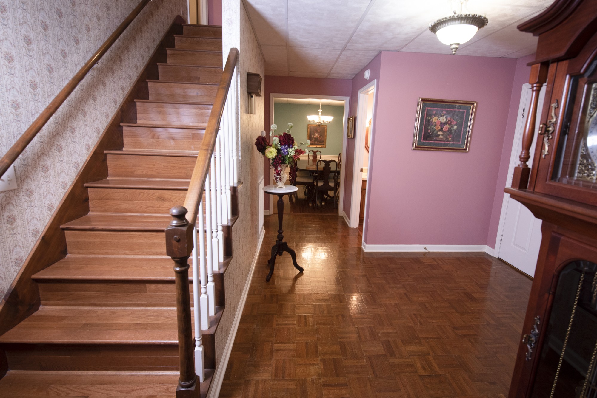 836 Dripping Springs Road Winchester, TN 37398 - Photo 18 of 37 a view of staircase with lots of frames on wall and a dining table