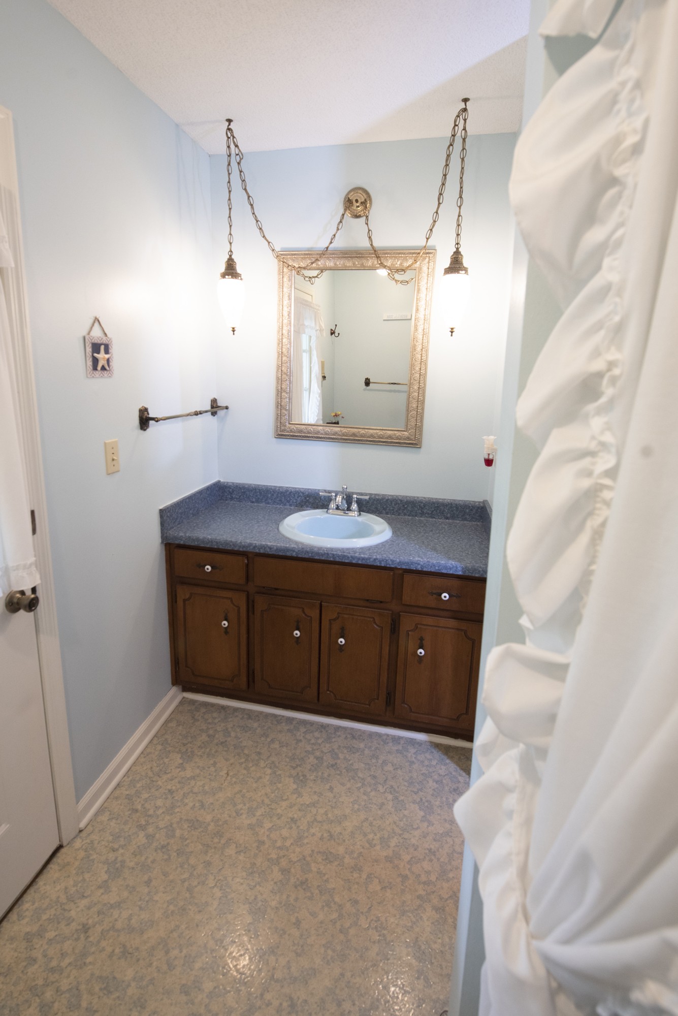 836 Dripping Springs Road Winchester, TN 37398 - Photo 27 of 37 a spacious bathroom with a granite countertop sink and a mirror