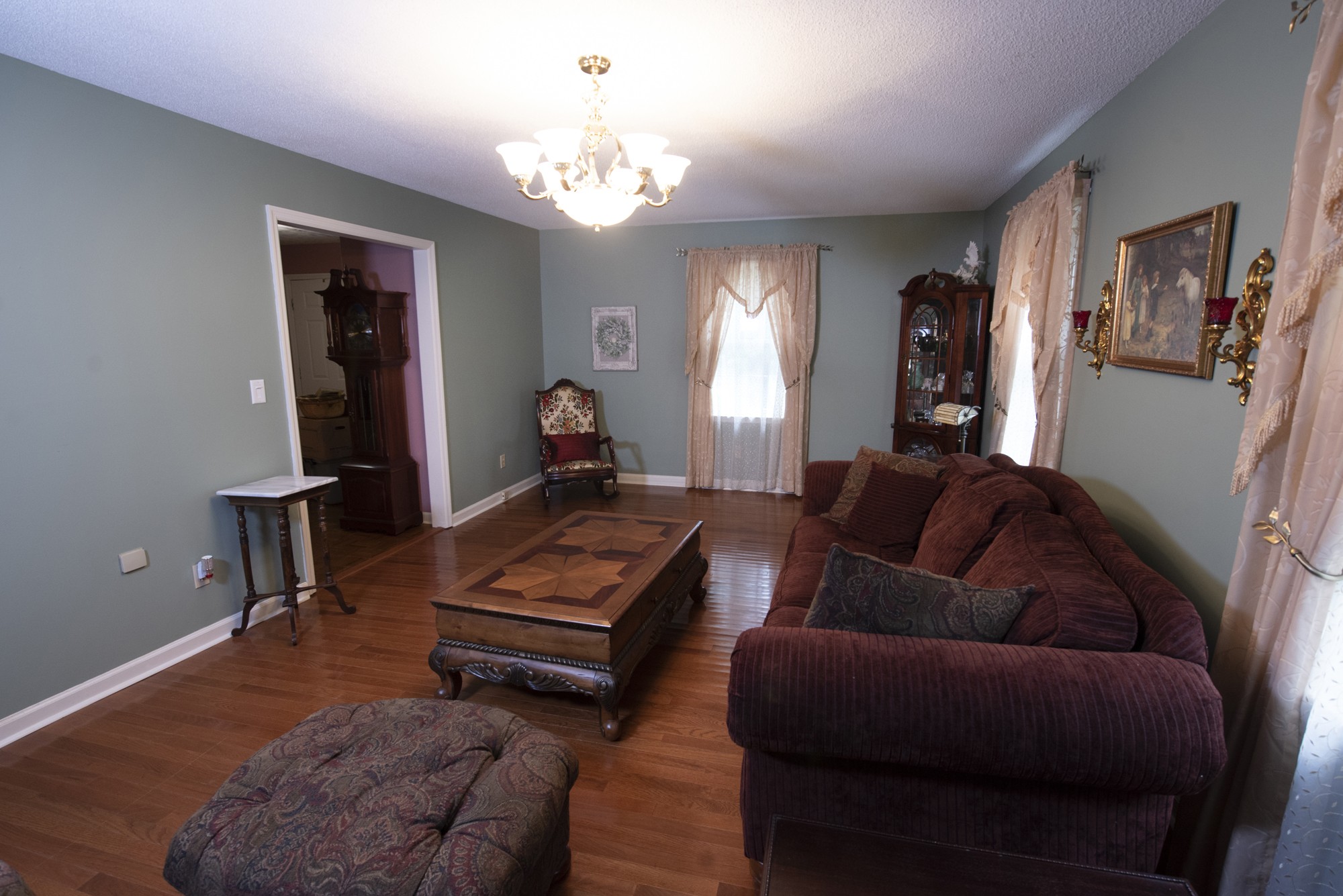 836 Dripping Springs Road Winchester, TN 37398 - Photo 6 of 37 a living room with furniture a dining table and a chandelier