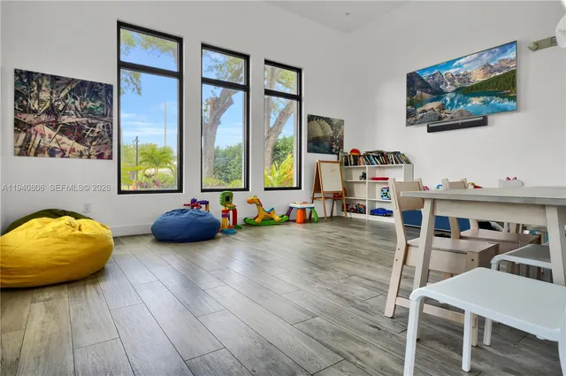 a bed room with furniture and window