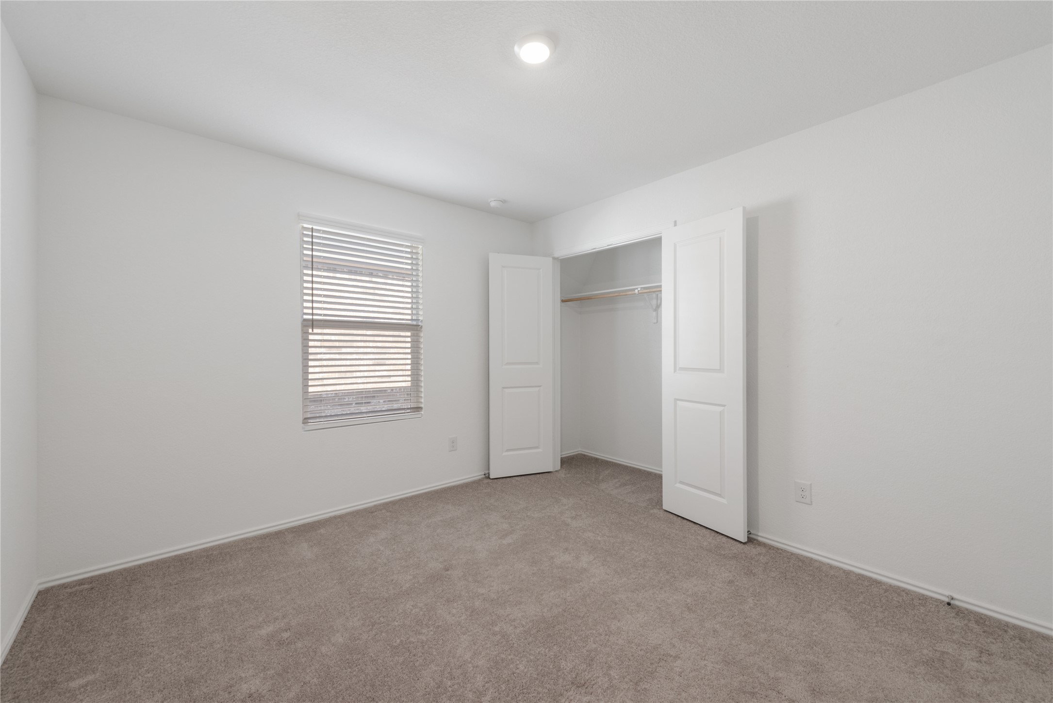 153 Sormonne Loop Kyle, TX 78640 - Photo 12 of 17 an empty room with windows