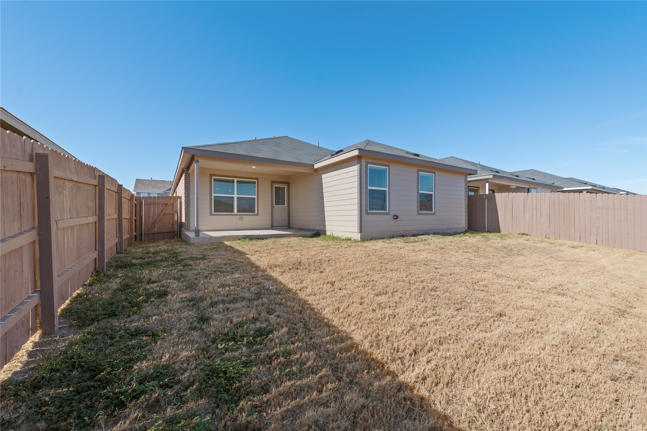 153 Sormonne Loop Kyle, TX 78640 - Photo 15 of 17 a view of a house with a yard