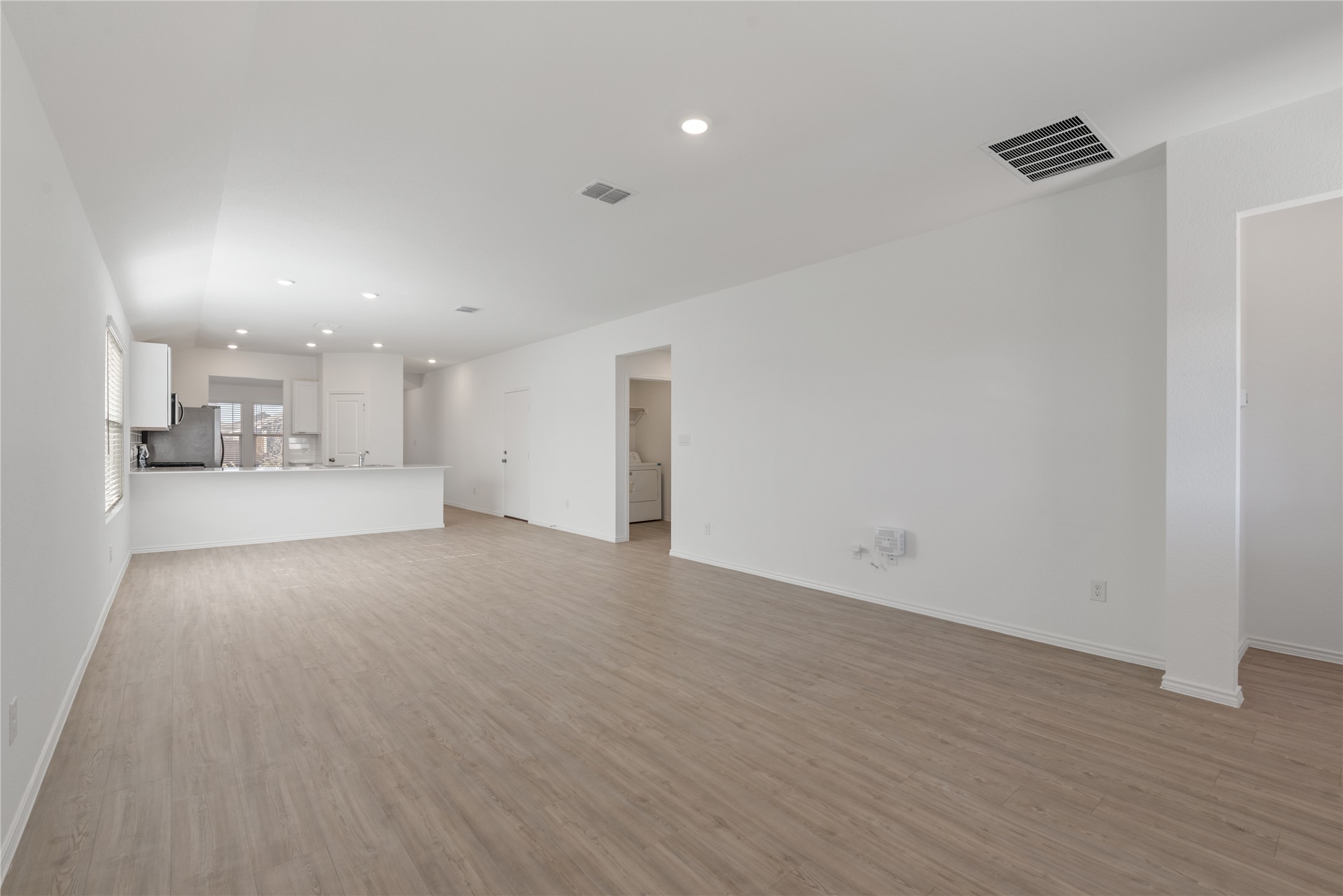 153 Sormonne Loop Kyle, TX 78640 - Photo 3 of 17 a view of a kitchen with a sink and a window