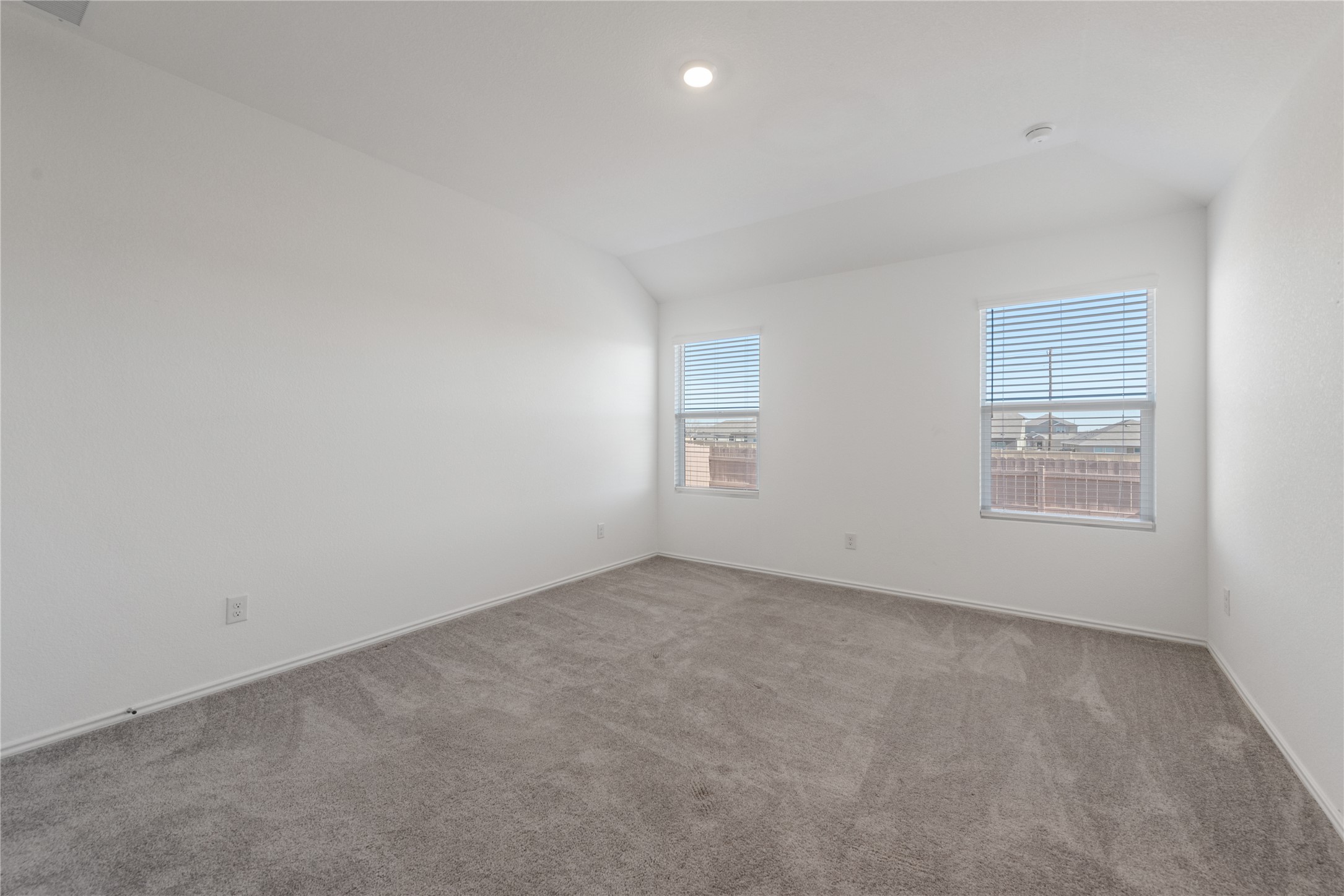 153 Sormonne Loop Kyle, TX 78640 - Photo 8 of 17 an empty room with windows