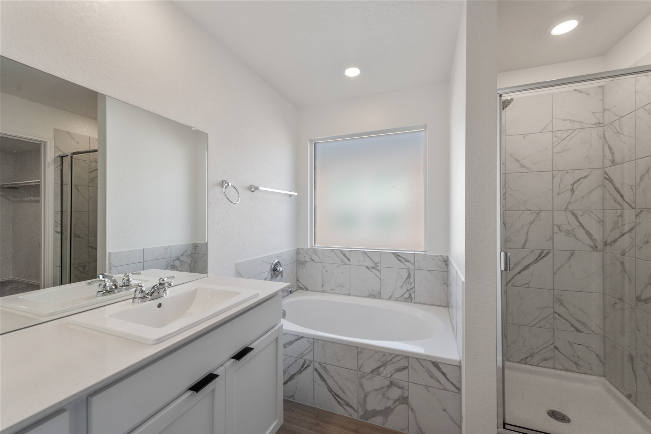 153 Sormonne Loop Kyle, TX 78640 - Photo 9 of 17 a bathroom with a bathtub and a sink