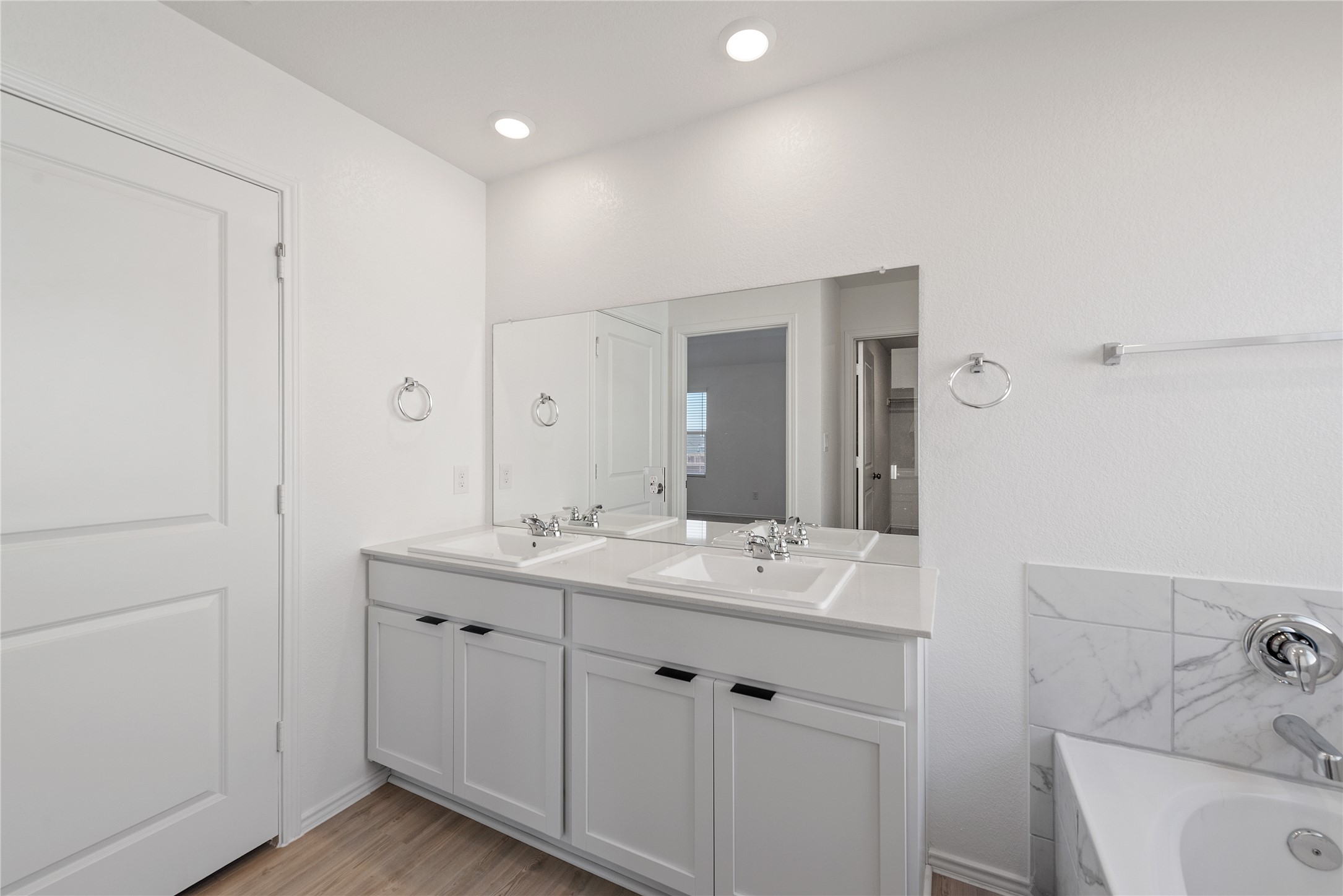 153 Sormonne Loop Kyle, TX 78640 - Photo 10 of 17 a bathroom with a sink and a mirror