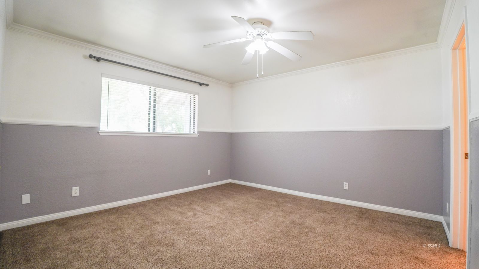 293 East Upjohn Avenue Ridgecrest, CA 93555 - Photo 16 of 21 an empty room with windows and fan