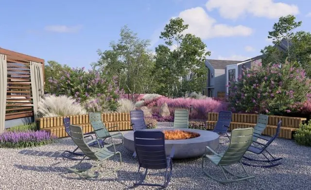 a view of a patio with a table and chairs