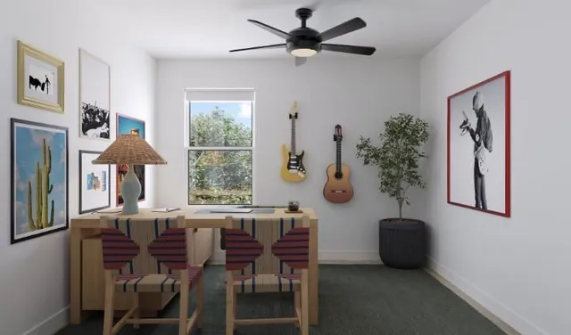 a view of a livingroom with furniture and a window