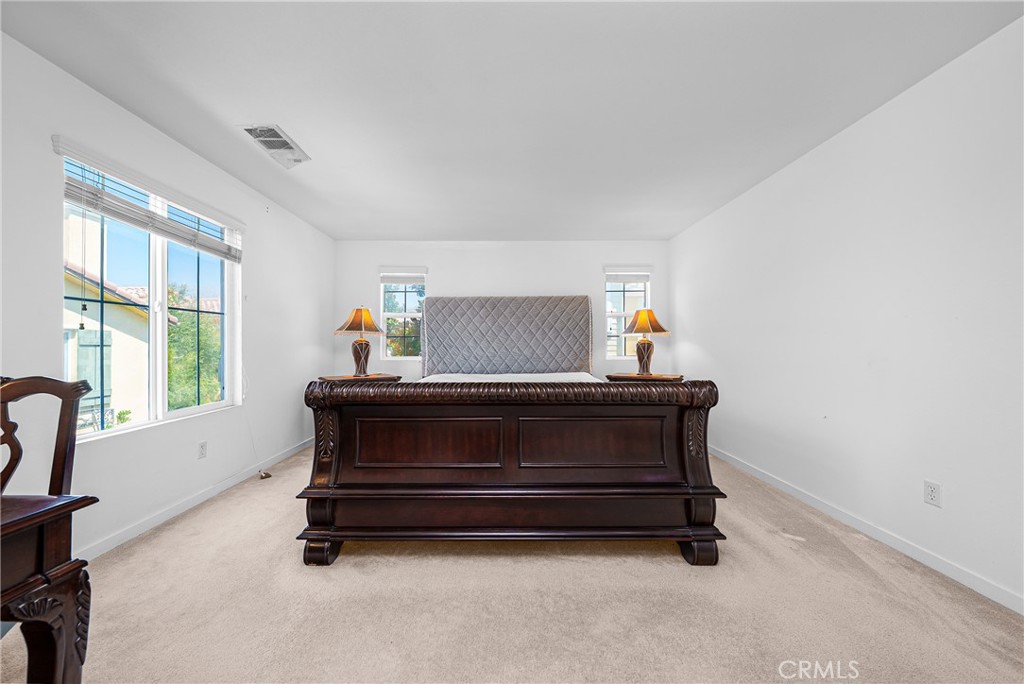 907 North Cornejo Way Azusa, CA 91702 - Photo 13 of 22 a bed sitting in a room next to a window