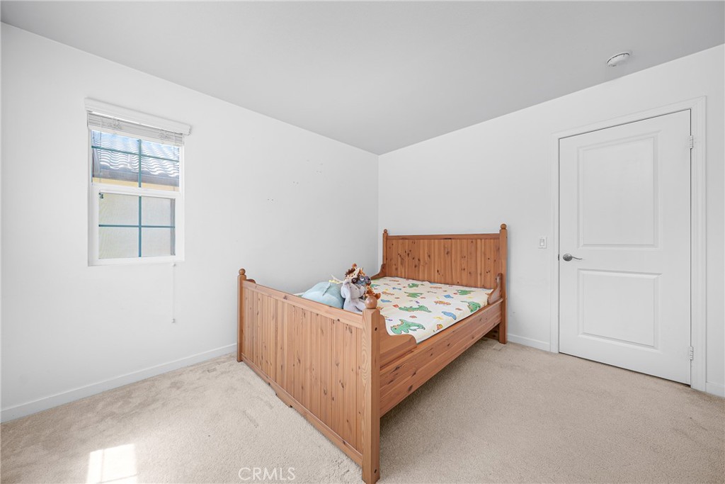907 North Cornejo Way Azusa, CA 91702 - Photo 18 of 22 an entryway with bed and window