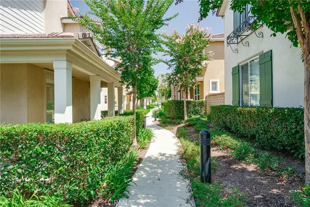 a view of a pathway with a house in the background