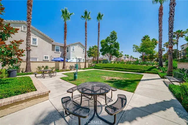 a view of a backyard with sitting area