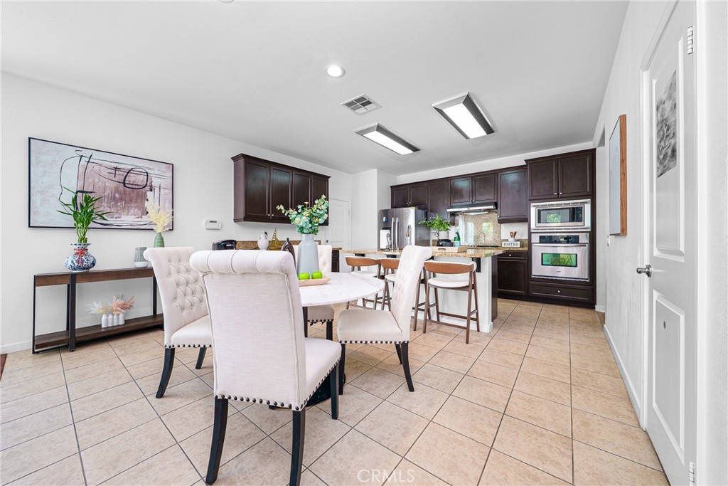 907 North Cornejo Way Azusa, CA 91702 - Photo 8 of 22 a living room with stainless steel appliances kitchen island granite countertop furniture and a kitchen view