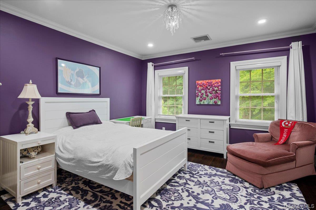 7 Harcourt Road Scarsdale, NY 10583 - Photo 22 of 34 a bedroom with a bed and a couch