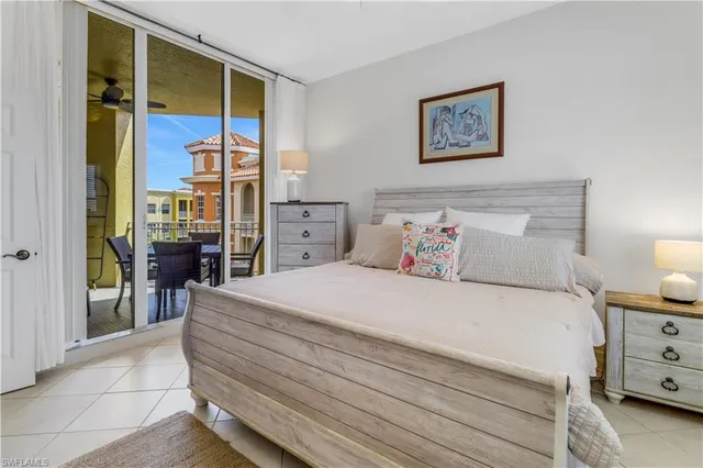 a bedroom with a bed and a view of walk in closet