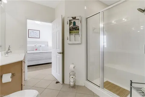 a bathroom with a tub shower sink and toilet
