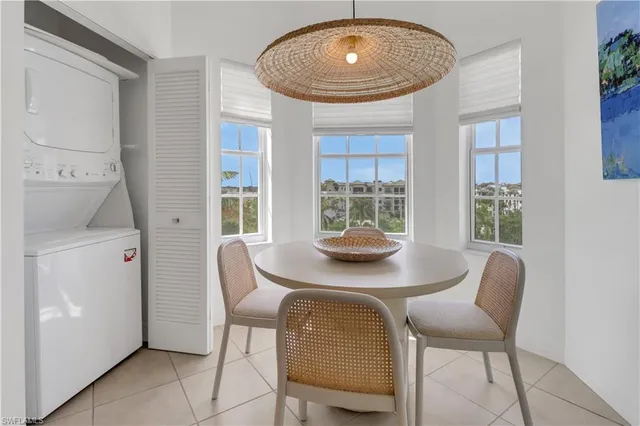 a view of a dining room with furniture and window